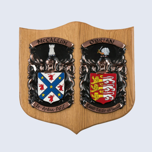 A sample image of a Bespoke Coat of Arms Shield made of Medium Double Oak and displaying the family names of MacCallum and O'Brian.